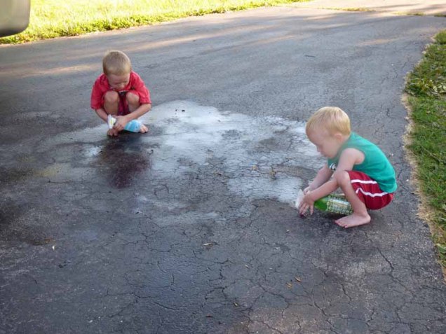b Owen and Cam Spraying Water on Driveway